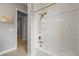 Updated bathroom showcasing a modern tub with gold fixtures and subway tile surround at 14341 Beebalm Loop, Parker, CO 80134