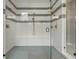 Luxurious walk-in shower featuring decorative tile, dual shower heads, and a built-in bench at 14341 Beebalm Loop, Parker, CO 80134