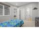 Sunny bedroom features large windows and an attached bathroom at 14341 Beebalm Loop, Parker, CO 80134