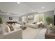 Bright basement living room featuring a comfortable seating area and entertainment space at 14341 Beebalm Loop, Parker, CO 80134