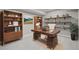 Stylish office with built-in shelves, desk, and a comfortable chair at 14341 Beebalm Loop, Parker, CO 80134