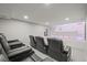 Home theater featuring reclining seating and a large screen for immersive entertainment at 14341 Beebalm Loop, Parker, CO 80134