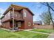 Beautiful backyard with a cozy patio area, a well-maintained lawn, and a private second-story balcony at 2927 N Humboldt St, Denver, CO 80205