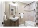 Bathroom with tiled shower and classic vanity at 2927 N Humboldt St, Denver, CO 80205