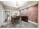 Charming dining room with exposed brick wall and stylish wood flooring at 2927 N Humboldt St, Denver, CO 80205