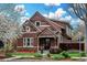 Charming two-story home with a well-maintained front yard, decorative brickwork, and colorful accents at 2927 N Humboldt St, Denver, CO 80205