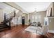 Bright living room with hardwood floors, staircase, and ample natural light at 2927 N Humboldt St, Denver, CO 80205