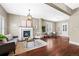 Inviting living room with hardwood floors, a fireplace, and neutral decor and plenty of natural light at 2927 N Humboldt St, Denver, CO 80205