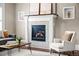 Cozy living room with fireplace and accent seating at 2927 N Humboldt St, Denver, CO 80205