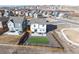 A beautiful backyard featuring a turf area, fence, and outdoor seating for entertaining at 610 Mosquito St, Elizabeth, CO 80107