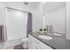 Well-lit bathroom featuring an extended countertop, tiled bath and shower combination at 610 Mosquito St, Elizabeth, CO 80107