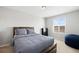 Cozy bedroom with natural light, neutral walls, carpet floors and simple decor at 610 Mosquito St, Elizabeth, CO 80107
