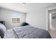 Bedroom with natural light, neutral walls, carpet floors, and simple decor at 610 Mosquito St, Elizabeth, CO 80107