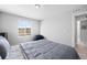Bedroom with natural light, neutral walls, carpet floors, and simple decor at 610 Mosquito St, Elizabeth, CO 80107