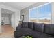 Cozy living room features a comfortable sofa, large window, and neutral color scheme at 610 Mosquito St, Elizabeth, CO 80107