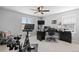 Well-lit office space featuring a desk, chair, and a stationary bike for convenient workouts at 610 Mosquito St, Elizabeth, CO 80107