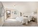 Bright bedroom with slanted ceilings and a walk-out balcony and deck at 461 N Marion St, Denver, CO 80218