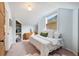 Light blue bedroom with a twin bed and built-in shelves at 461 N Marion St, Denver, CO 80218