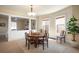 Open dining room featuring neutral paint, carpeted floors and large windows for natural light at 461 N Marion St, Denver, CO 80218
