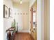 Welcoming entryway featuring terracotta tile flooring, coat hooks, and a stylish cactus arrangement at 461 N Marion St, Denver, CO 80218