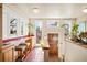 Bright kitchen featuring tile floors, a breakfast bar, and a wall of windows, perfect for growing plants at 461 N Marion St, Denver, CO 80218