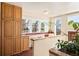 Bright kitchen featuring tile floors, lots of cabinets for storage, and a large window for natural light at 461 N Marion St, Denver, CO 80218