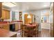 Retro kitchen with an eat-in breakfast nook, terracotta floors, lots of storage, and plenty of counter space at 461 N Marion St, Denver, CO 80218