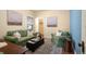 Cozy living room with comfortable seating, an area rug, and neutral walls at 461 N Marion St, Denver, CO 80218