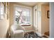 Cozy sunroom with a reading chair in front of a large window with views of the neighborhood at 461 N Marion St, Denver, CO 80218