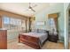 Inviting bedroom features a vaulted ceiling, large windows, and carpeted floors at 19602 E 63Rd Dr, Aurora, CO 80019
