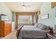 Bedroom featuring large windows with blinds and curtains, and carpeted floors at 19602 E 63Rd Dr, Aurora, CO 80019