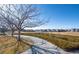 Beautiful community park with a scenic walking path and green space, ideal for recreation at 19602 E 63Rd Dr, Aurora, CO 80019