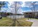 Fenced community pool area with grassy surroundings, amenities, and a clear blue sky at 19602 E 63Rd Dr, Aurora, CO 80019