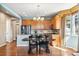 Kitchen and dining area featuring stainless steel appliances, hardwood floors, and ample cabinetry at 19602 E 63Rd Dr, Aurora, CO 80019