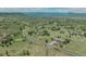 Lovely aerial view of a home situated on a large lot with winding roads and mountain views in the distance at 3535 Medallion Rd, Castle Rock, CO 80104