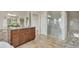 Elegant bathroom featuring wood cabinets, granite counters, and a spacious glass-enclosed shower at 3535 Medallion Rd, Castle Rock, CO 80104