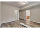 Bedroom featuring tile floors, white trim, and a view into the bathroom at 3535 Medallion Rd, Castle Rock, CO 80104