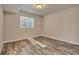 Bedroom with tile floor, white trim, and a large window for natural light at 3535 Medallion Rd, Castle Rock, CO 80104