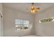 Neutral bedroom with natural light, fan, and double-hung windows at 3535 Medallion Rd, Castle Rock, CO 80104
