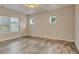 Bedroom with tile floor and two small windows, plus a large window for natural light at 3535 Medallion Rd, Castle Rock, CO 80104