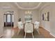 Bright dining room features a modern chandelier and large windows at 3535 Medallion Rd, Castle Rock, CO 80104