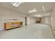 Large garage with workbench, service door, and room for storage or vehicles at 3535 Medallion Rd, Castle Rock, CO 80104