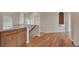 Hallway featuring hardwood floors, a staircase, and a granite counter bar area at 3535 Medallion Rd, Castle Rock, CO 80104
