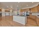 Gourmet kitchen featuring a large island and adjacent living areas at 3535 Medallion Rd, Castle Rock, CO 80104