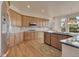 Well-lit kitchen features stainless steel appliances, granite countertops, and a view at 3535 Medallion Rd, Castle Rock, CO 80104