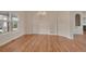 Elegant living room with hardwood floors, large windows, and chandelier lighting at 3535 Medallion Rd, Castle Rock, CO 80104