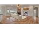 Living room featuring hardwood floors, a white sofa, and a stone fireplace at 3535 Medallion Rd, Castle Rock, CO 80104
