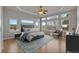 The light-filled main bedroom features large windows and a luxurious ensuite bathroom at 3535 Medallion Rd, Castle Rock, CO 80104