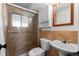 Updated bathroom with tile shower, vanity with mirror, and sleek fixtures at 255 Iroquois Dr, Boulder, CO 80303