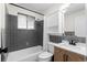 Well-lit bathroom with tile, updated vanity, and a shower-tub combination at 255 Iroquois Dr, Boulder, CO 80303